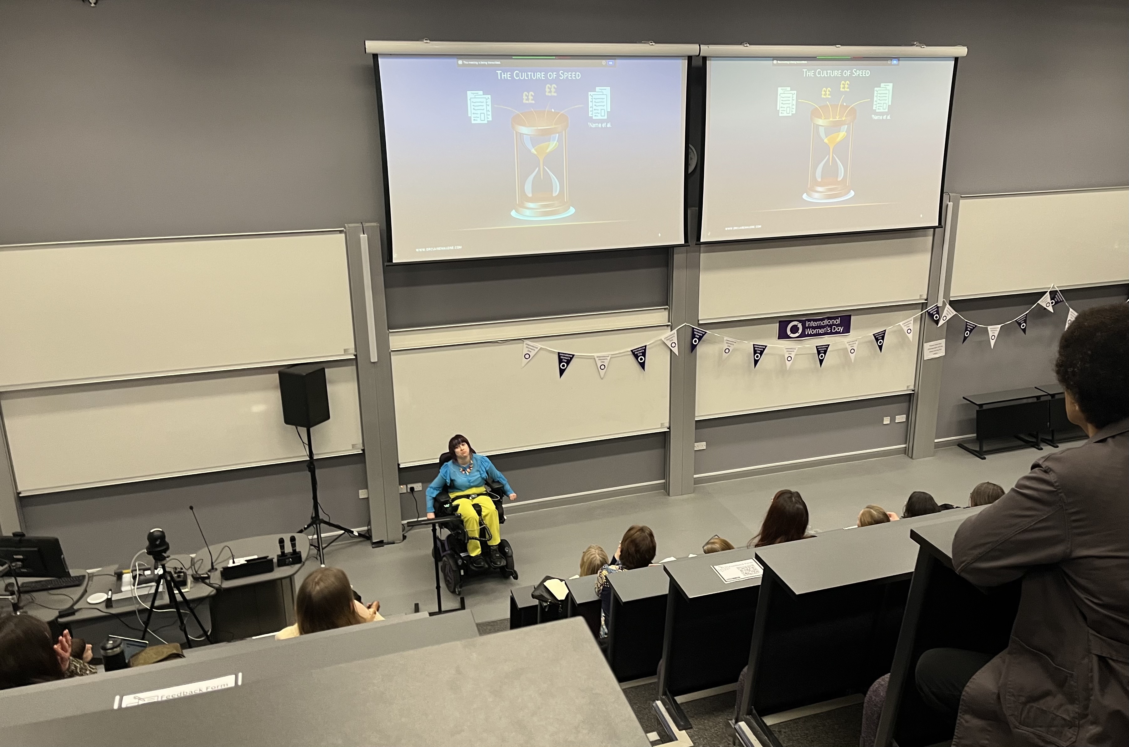 Dr. Malone delivering her IWD talk