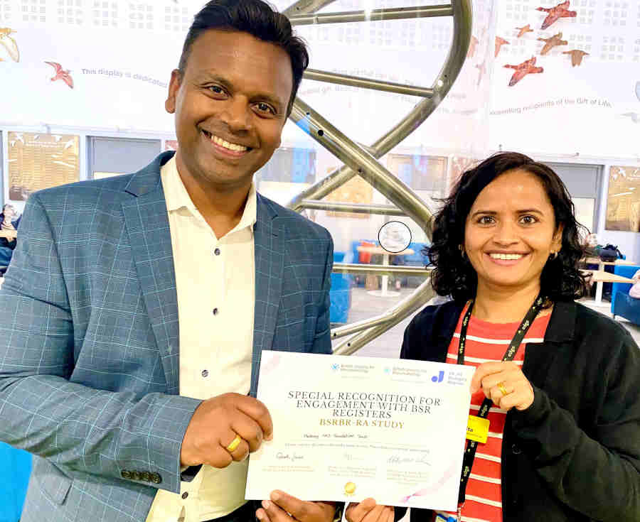 Sabita and Dr Srirangan holding a certificate for 'Special recognition for engagement with BSR registers'.