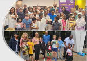 Two pictures bottom and top half. Both show adults and children standing in a row. In the top one they are indoors in front of a purple banner. In the bottom one they are outside in front of a building.