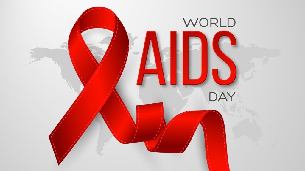 A red ribbon with a world map, with the words 'World AIDS Day' in front