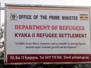 image of a sign saying department of refugees kyaka II refugee settlement