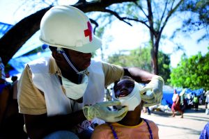 First Aid Responder providing humanitarian aid