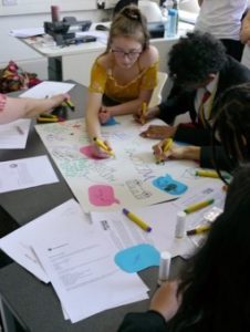 young people working together at a table