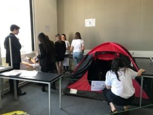 people inspecting a tent