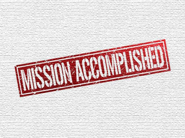 Mission Accomplished logo on textured background