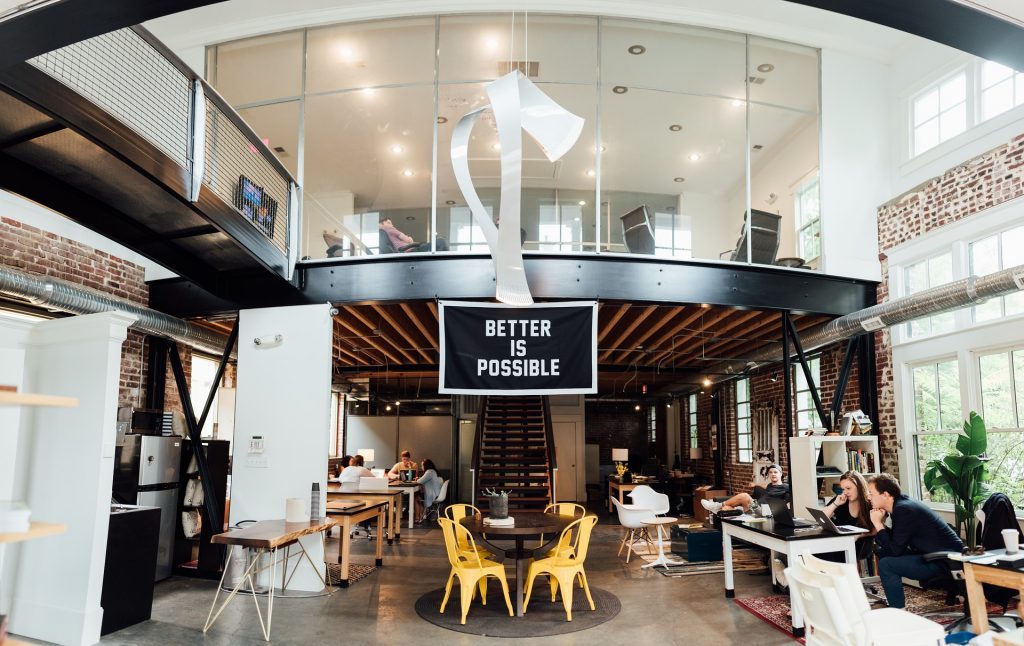 Large office space with central sign 'Better is possible'