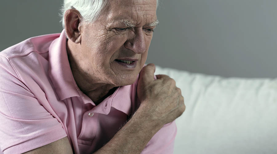 Older man with shoulder discomfort