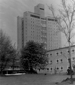 A black and white image of an apartment block