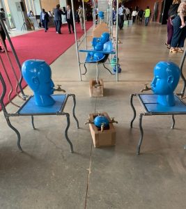 The picture shows blue sculptures with water taps coming out of their mouths as part of the WWF