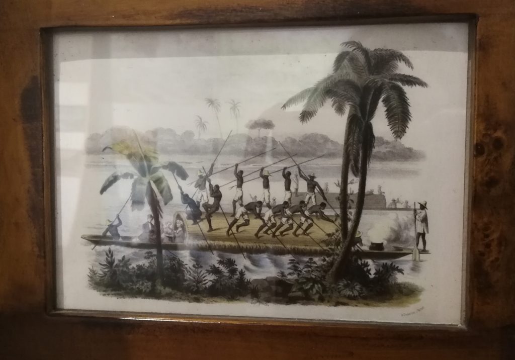 Image of Spanish colonialists crossing Colombia's river Magdalena with African slaves.