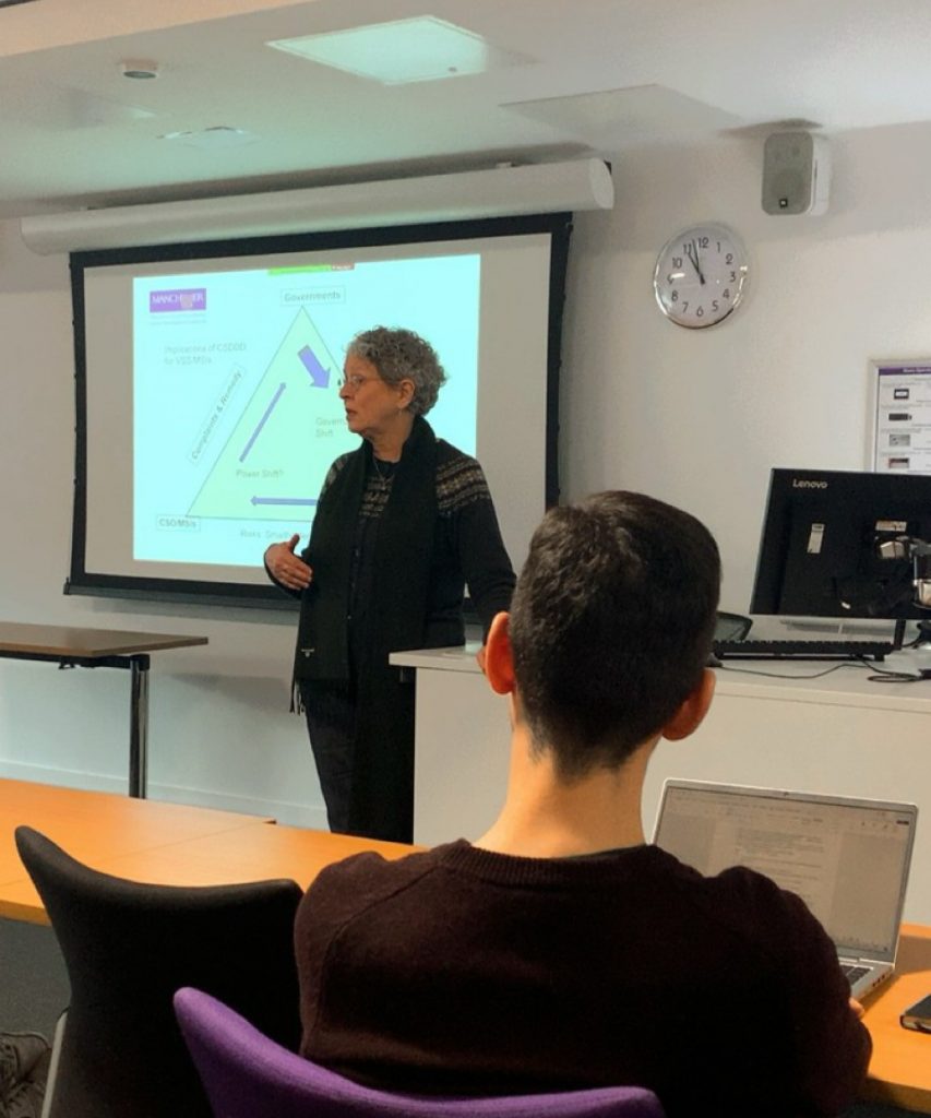 A woman presenting a talk