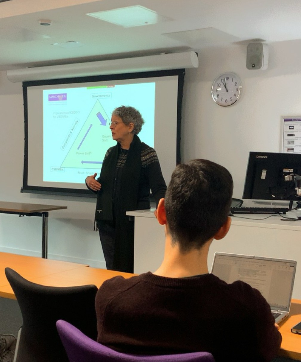 A woman presenting a talk