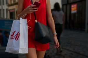 Woman shopping at fast fashion brand H & M