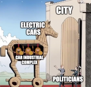 Hollowed horse carrying people approaching a city gate.